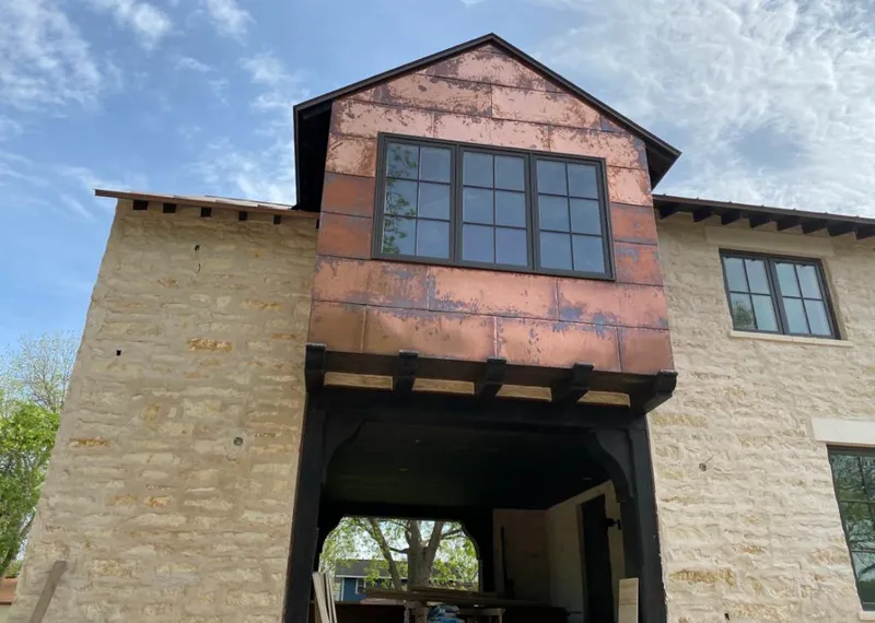 Copper metal panel facade on a stone building for Metal Roof Coating in Fort Mohave